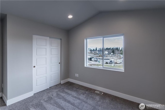 18911 Eagle Ridge Dr E Unit Lt527, Bonney Lake, WA 98391 - unfurnished bedroom featuring dark carpet, vaulted ceiling, and recessed lighting