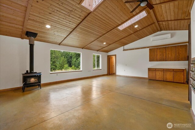 7609 Pressentin Ct, Concrete, WA 98237 - unfurnished living room featuring a wood ceiling with exposed beams, a wall mounted air conditioner, ceiling fan, finished concrete floors, and a wood stove
