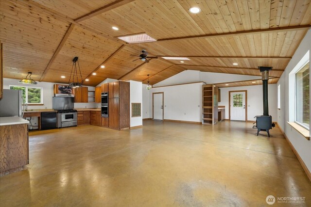7609 Pressentin Ct, Concrete, WA 98237 - unfurnished living room with a wood stove, wood ceiling, concrete floors, recessed lighting, and ceiling fan