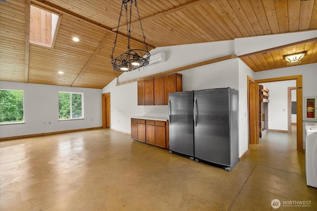 7609 Pressentin Ct, Concrete, WA 98237 - kitchen featuring freestanding refrigerator, finished concrete floors, wooden ceiling, brown cabinetry, and light countertops
