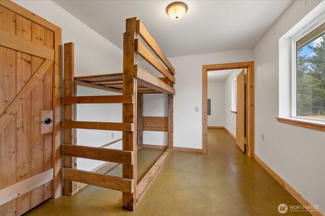 7609 Pressentin Ct, Concrete, WA 98237 - corridor with finished concrete flooring and baseboards