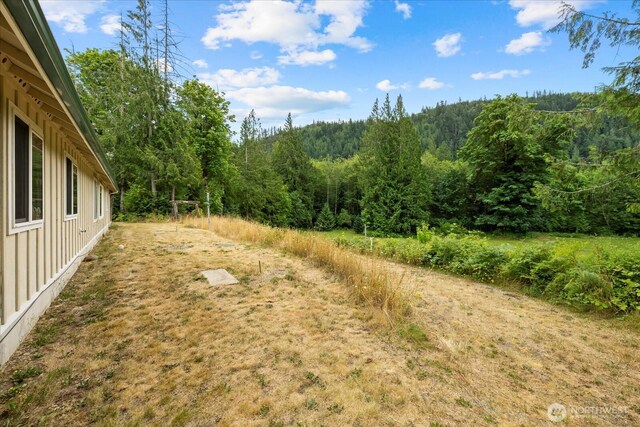7609 Pressentin Ct, Concrete, WA 98237 - view of yard with a view of trees