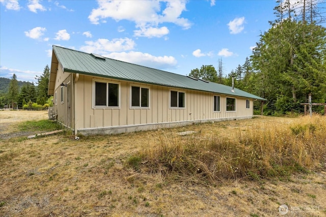 7609 Pressentin Ct, Concrete, WA 98237 - view of home's exterior with board and batten siding and a metal roof