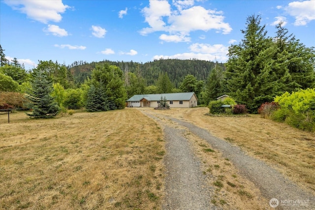 7609 Pressentin Ct, Concrete, WA 98237 - view of front of home featuring a forest view and driveway
