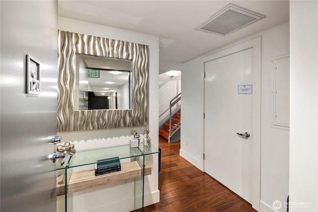 2911 2nd Ave Unit 120, Seattle, WA 98121 - hallway featuring dark wood-style flooring and stairway