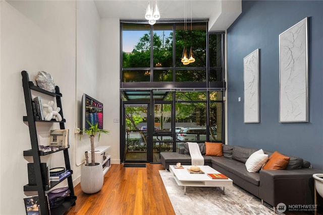 2911 2nd Ave Unit 120, Seattle, WA 98121 - living room with healthy amount of natural light, wood finished floors, and expansive windows