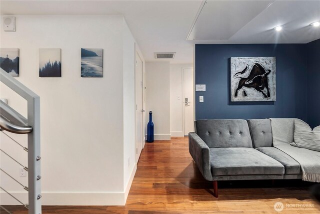 2911 2nd Ave Unit 120, Seattle, WA 98121 - living room featuring wood finished floors and attic access