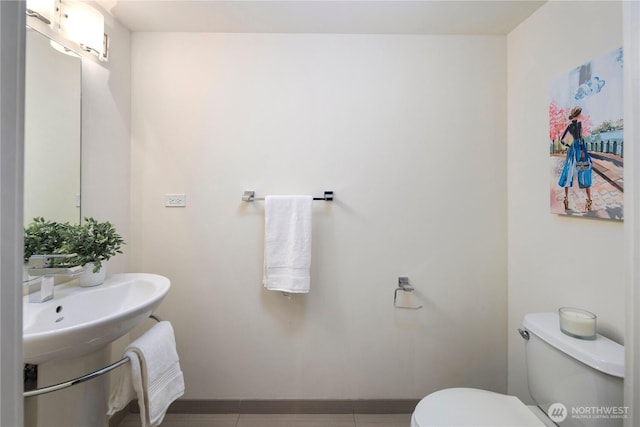 2911 2nd Ave Unit 120, Seattle, WA 98121 - half bath featuring toilet and baseboards