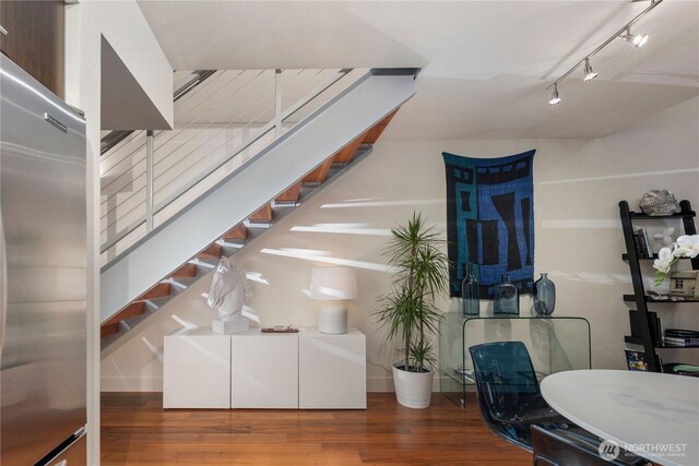 2911 2nd Ave Unit 120, Seattle, WA 98121 - staircase with wood finished floors and track lighting