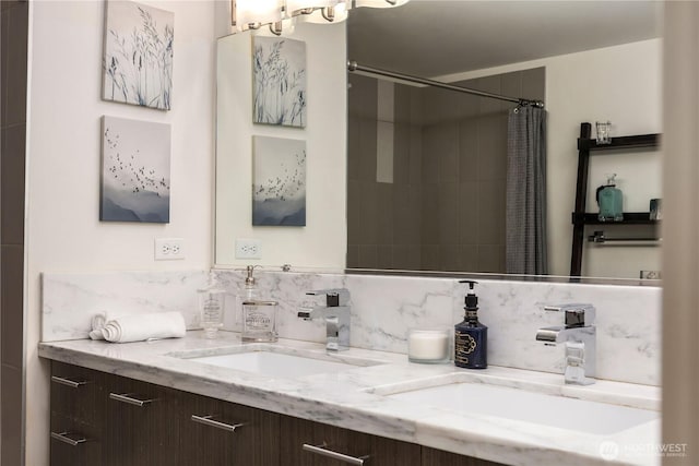 2911 2nd Ave Unit 120, Seattle, WA 98121 - bathroom with double vanity, tasteful backsplash, and curtained shower