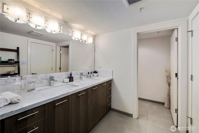 2911 2nd Ave Unit 120, Seattle, WA 98121 - bathroom featuring double vanity and tile patterned floors