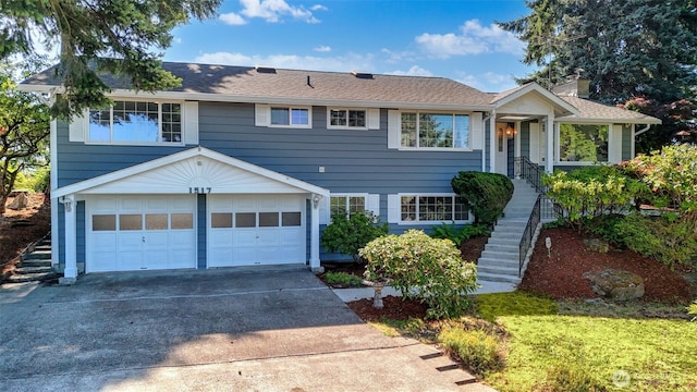 1517 126th Ave E, Edgewood, WA 98372 - view of front of home featuring stairs, an attached garage, driveway, and a chimney