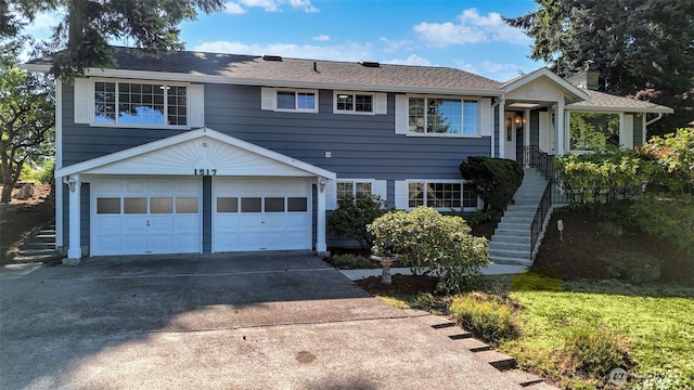 1517 126th Ave E, Edgewood, WA 98372 - view of front of property with a garage, concrete driveway, and stairs