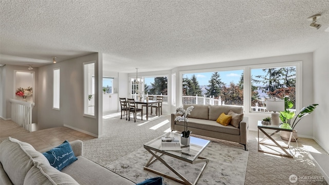 1517 126th Ave E, Edgewood, WA 98372 - living area with a textured ceiling, carpet floors, and a chandelier