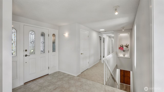 1517 126th Ave E, Edgewood, WA 98372 - foyer featuring a textured ceiling and baseboards