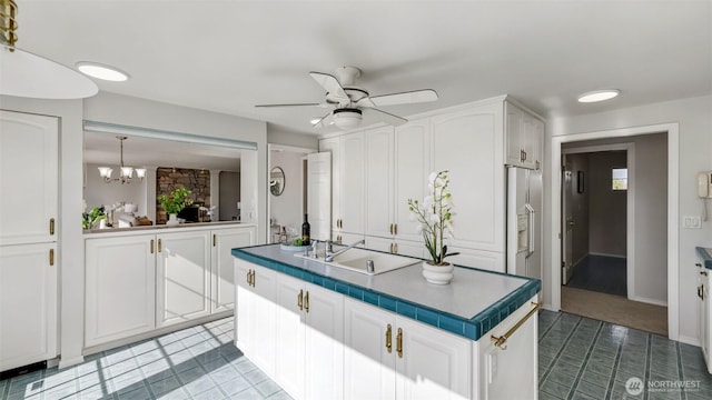 1517 126th Ave E, Edgewood, WA 98372 - kitchen featuring white cabinetry, ceiling fan, a chandelier, and tile patterned floors