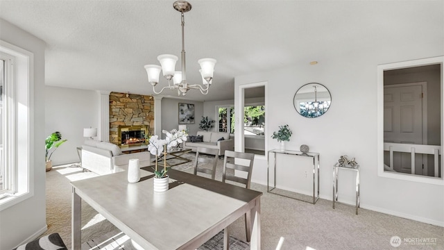 1517 126th Ave E, Edgewood, WA 98372 - dining space with a chandelier, light colored carpet, and a stone fireplace