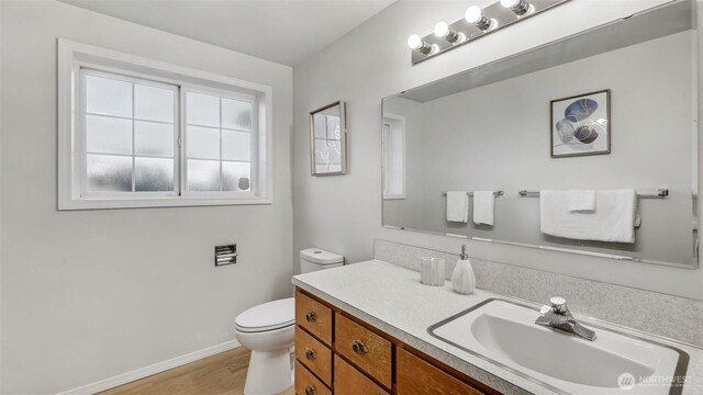 1517 126th Ave E, Edgewood, WA 98372 - bathroom featuring vanity and wood finished floors