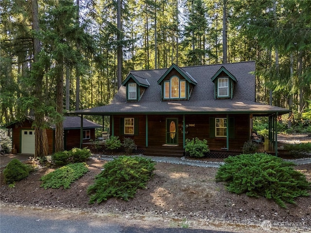 10723 105th Street Ct, Anderson Island, WA 98303 - view of front facade featuring a garage, covered porch, and an outbuilding