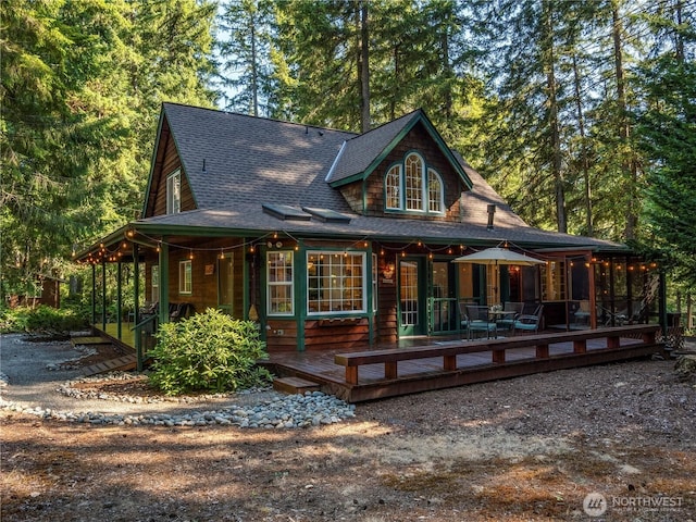 10723 105th Street Ct, Anderson Island, WA 98303 - view of front of property with roof with shingles and a deck