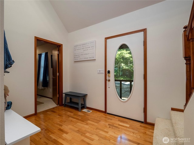 10723 105th Street Ct, Anderson Island, WA 98303 - entryway with light wood-style flooring and vaulted ceiling