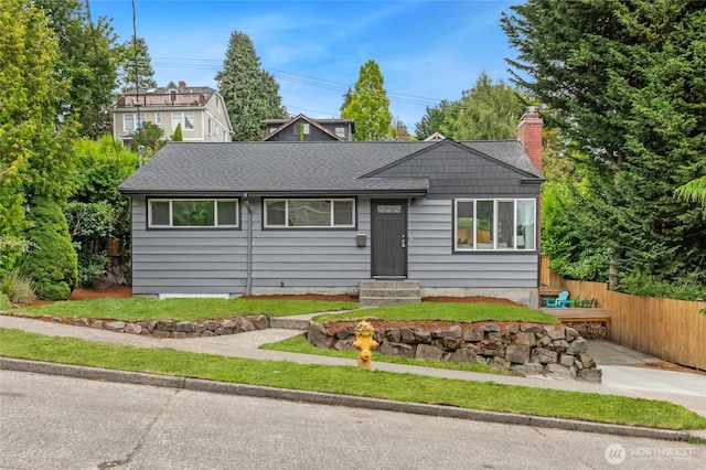 4130 Palatine Ave N, Seattle, WA 98103 - view of front facade with entry steps, a chimney, and a shingled roof