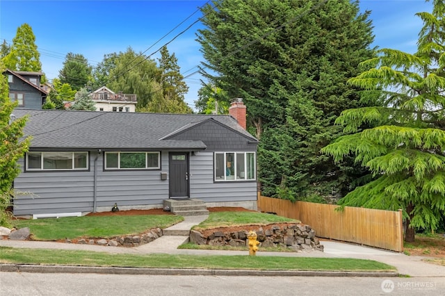4130 Palatine Ave N, Seattle, WA 98103 - view of front facade featuring roof with shingles and a chimney