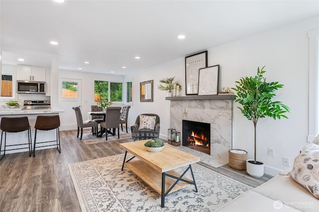 4130 Palatine Ave N, Seattle, WA 98103 - living room featuring a high end fireplace, dark wood finished floors, and recessed lighting