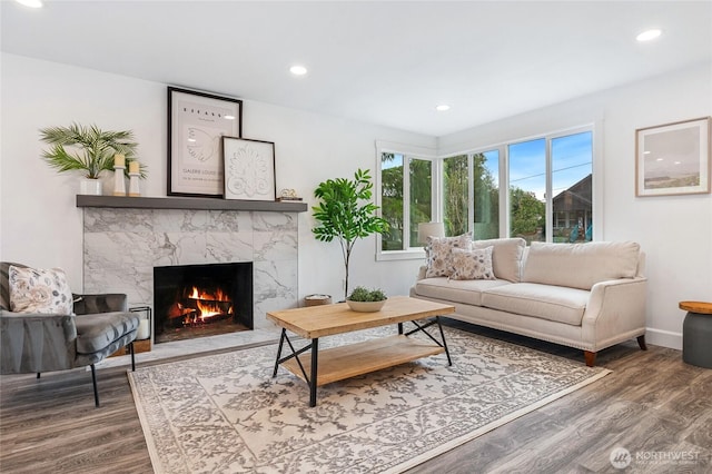 4130 Palatine Ave N, Seattle, WA 98103 - living room featuring a premium fireplace, wood finished floors, and recessed lighting