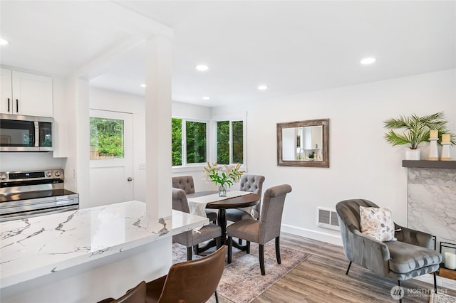 4130 Palatine Ave N, Seattle, WA 98103 - dining room featuring light wood-style flooring and recessed lighting