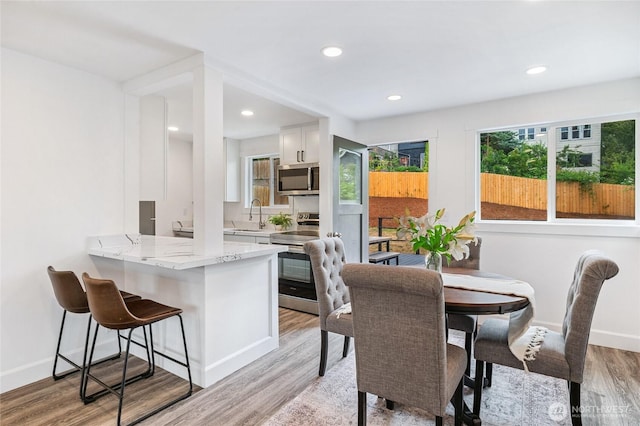 4130 Palatine Ave N, Seattle, WA 98103 - dining area with plenty of natural light, light wood-style flooring, and recessed lighting