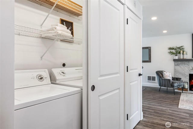 4130 Palatine Ave N, Seattle, WA 98103 - laundry area featuring dark wood finished floors, separate washer and dryer, and recessed lighting