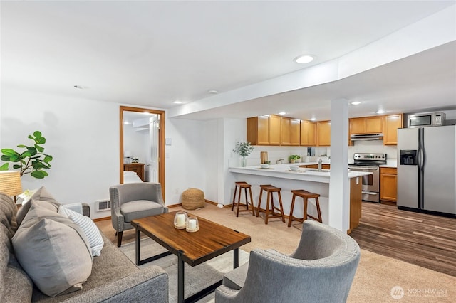 4130 Palatine Ave N, Seattle, WA 98103 - living room featuring recessed lighting and carpet flooring