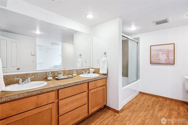 4130 Palatine Ave N, Seattle, WA 98103 - bathroom with wood finished floors and double vanity
