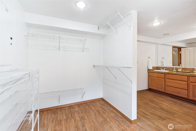 4130 Palatine Ave N, Seattle, WA 98103 - spacious closet with a sink and light wood finished floors