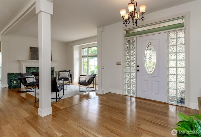 29851 12th Ave SW, Federal Way, WA 98023 - foyer featuring wood finished floors, a tile fireplace, and a chandelier