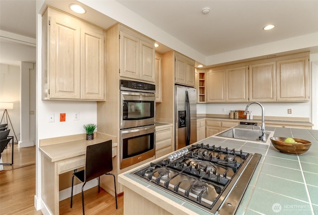 29851 12th Ave SW, Federal Way, WA 98023 - kitchen with appliances with stainless steel finishes, light brown cabinets, recessed lighting, tile countertops, and light wood-style flooring