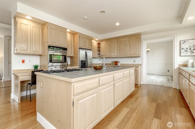 29851 12th Ave SW, Federal Way, WA 98023 - kitchen featuring appliances with stainless steel finishes, light brown cabinets, tile countertops, light wood finished floors, and recessed lighting