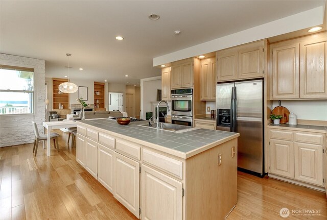 29851 12th Ave SW, Federal Way, WA 98023 - kitchen with stainless steel appliances, tile counters, light wood finished floors, light brown cabinetry, and recessed lighting