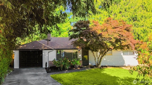 2536 S 286th St, Federal Way, WA 98003 - view of front of home with an attached garage, a chimney, asphalt driveway, and a front yard
