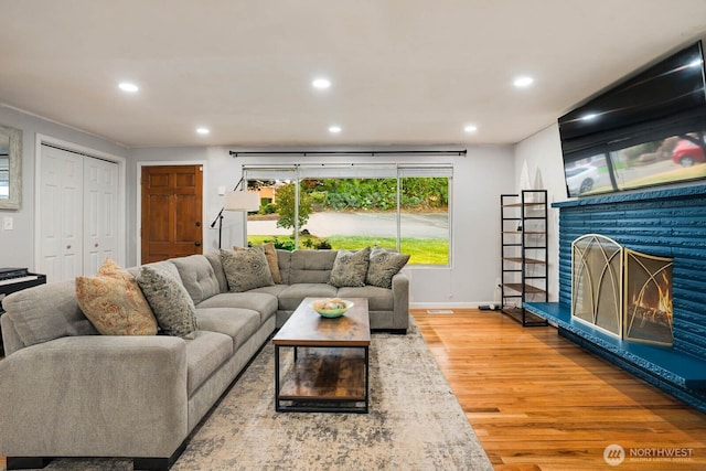 2536 S 286th St, Federal Way, WA 98003 - living area with wood finished floors, recessed lighting, and a fireplace
