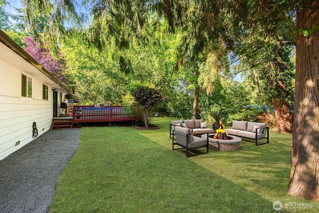 2536 S 286th St, Federal Way, WA 98003 - view of green lawn featuring an outdoor living space with a fire pit and a wooden deck