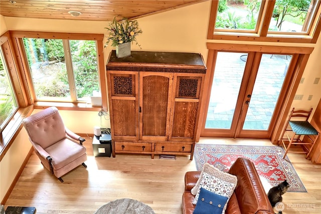 22307 E Lost Lake Rd, Snohomish, WA 98296 - living area with healthy amount of natural light, light wood-style floors, wood ceiling, and french doors