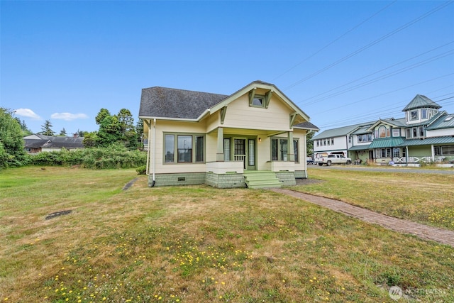 802 May St, Raymond, WA 98577 - view of front of house featuring a front lawn, crawl space, and roof with shingles