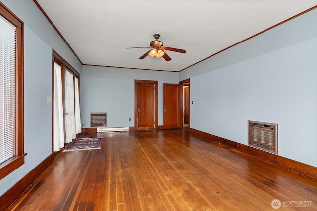802 May St, Raymond, WA 98577 - unfurnished living room with a fireplace, heating unit, a baseboard radiator, hardwood / wood-style floors, and ornamental molding