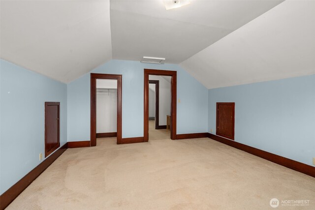 802 May St, Raymond, WA 98577 - additional living space with carpet flooring, vaulted ceiling, and baseboard heating