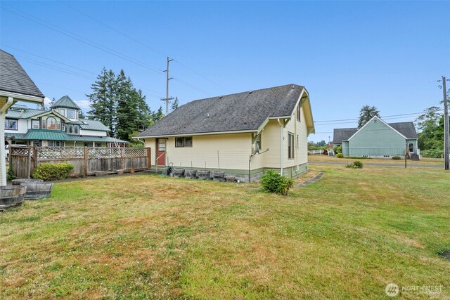 802 May St, Raymond, WA 98577 - rear view of property featuring a shingled roof