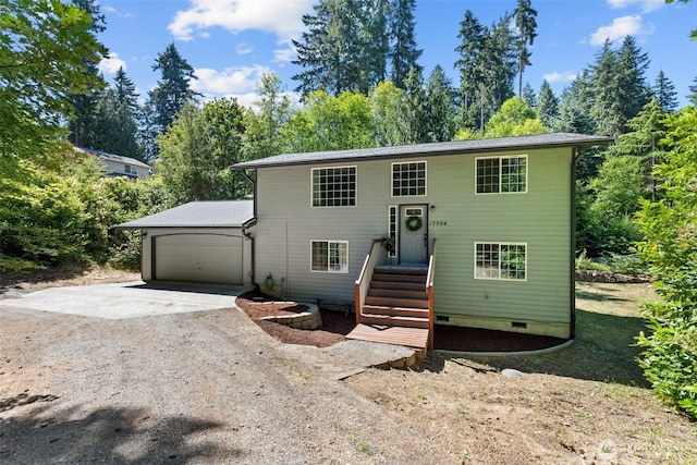 17504 Loop Ln SE, Yelm, WA 98597 - raised ranch featuring dirt driveway, a garage, crawl space, and view of wooded area