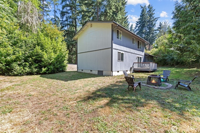 17504 Loop Ln SE, Yelm, WA 98597 - view of side of property with an outdoor fire pit, a yard, crawl space, and a deck