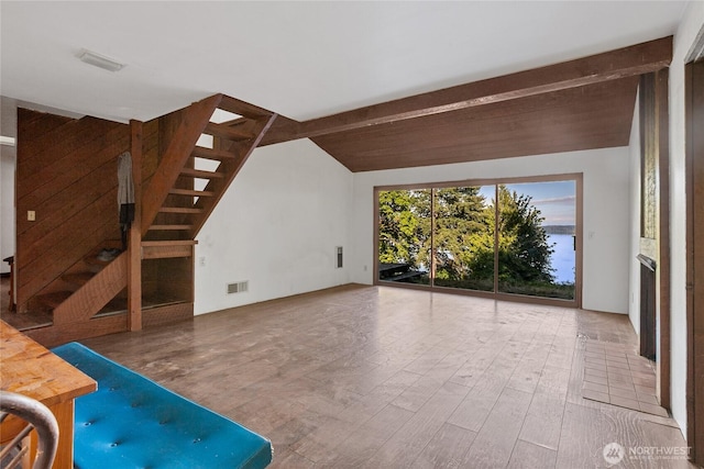 9744 Cascade Loop NE, Olympia, WA 98516 - unfurnished living room featuring wood finished floors and stairs